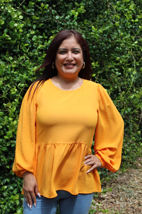 ORANGE RUFFLED HEM BLOUSE